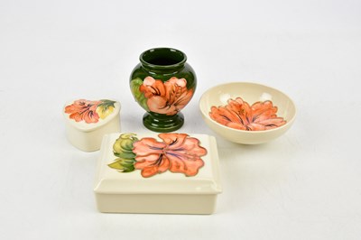 Lot 2762 - MOORCROFT; a group of four 'Hibiscus' pattern...