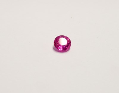 Lot 1076 - A loose 8.57 carat round ruby with GIL...