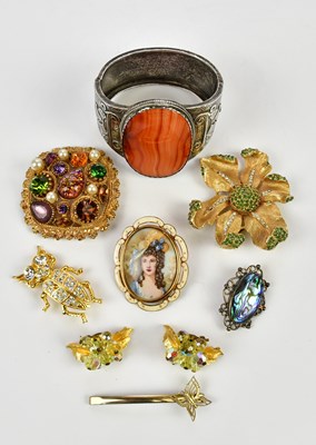Lot 477 - A silver and orange agate cuff bangle, with a...