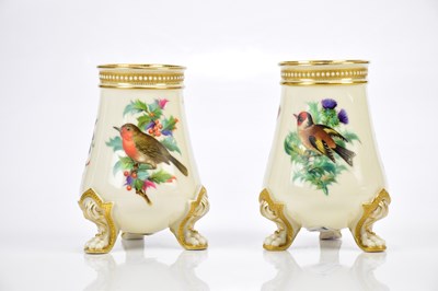 Lot 2871 - ROYAL WORCESTER; a pair of vases decorated...