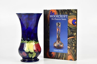 Lot 2773 - WILLIAM MOORCROFT; a large trumpet shaped vase...