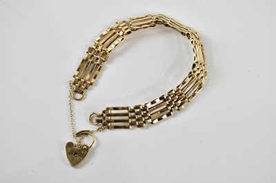 Lot 1563 - A 9ct yellow gold gate link bracelet with...
