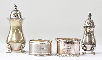 Lot 940 - Two hallmarked silver pepperettes, height of...