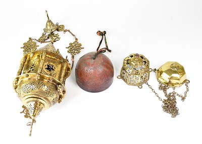 Lot 664 - An Eastern brass hanging lantern with pierced...