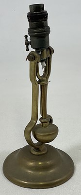 Lot 433 - A solid brass gimbal table lamp, impressed...