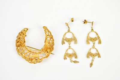 Lot 358 - A yellow metal crescent shaped filigree brooch...