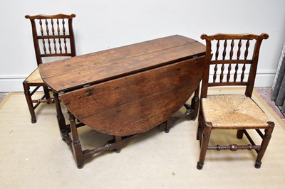 Lot 1148 - A harlequin set of eight 19th century elm...