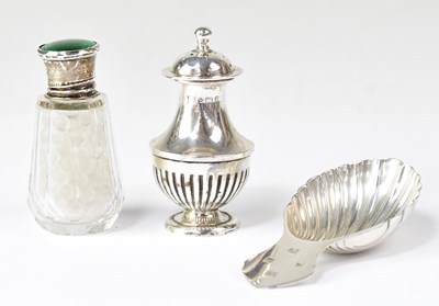 Lot 941 - A hallmarked silver shell-shaped caddy spoon,...