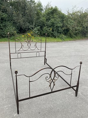 Lot 1176 - A modern painted cast metal double bed.
