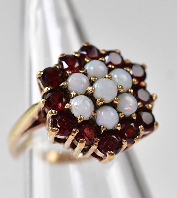Lot 1091 - A 9ct gold opal and ruby cluster ring, size L,...