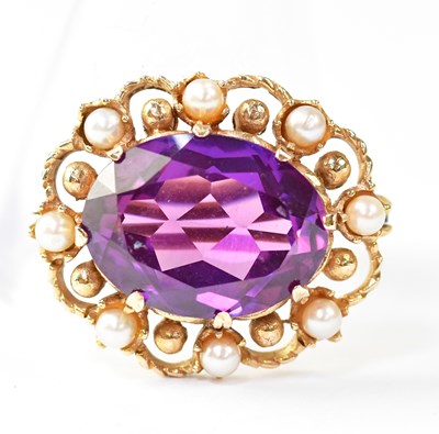 Lot 1173 - An amethyst and seed pearl brooch, the claw...