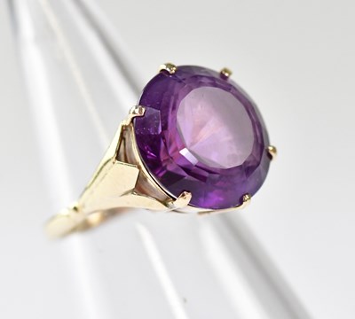 Lot 1099 - A 9ct gold dress ring with large...