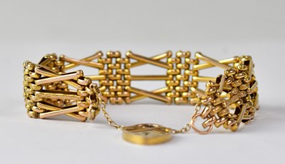 Lot 1151 - A 9ct gold five-bar gate bracelet with 9ct...