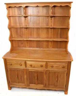 Lot 1428 - ERCOL; a light elm dresser with plate rack...