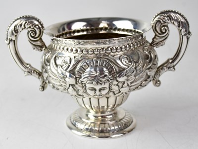 Lot 928 - CHARLES EDWARDS; an Edward VII twin-handled...