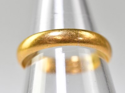 Lot 1059 - A 22ct gold wedding band, size P, approx. 3.7g.