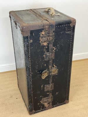 Lot 587 - A large black painted wooden and metal travel...