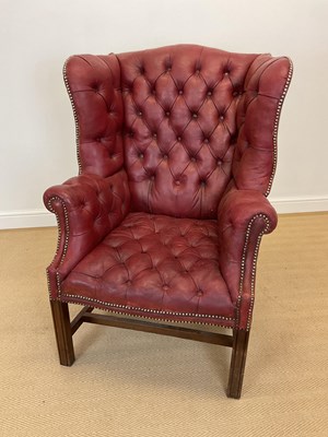 Lot 577 - A reproduction red leather button back...