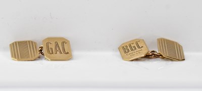 Lot 1233 - A pair of 9ct gold cufflinks, front with...