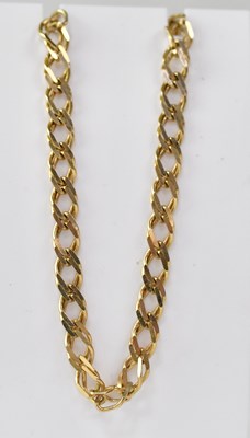 Lot 1142 - A 9ct gold flat curb bracelet with lobster...