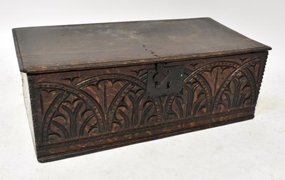 Lot 573 - An 18th century oak Bible box with carved leaf...