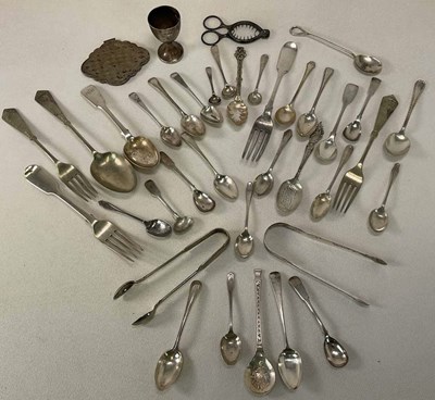 Lot 1434 - A group of silver and white metal flatware...