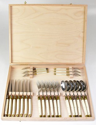 Lot 878 - A wooden cased six-setting Laguiole French...