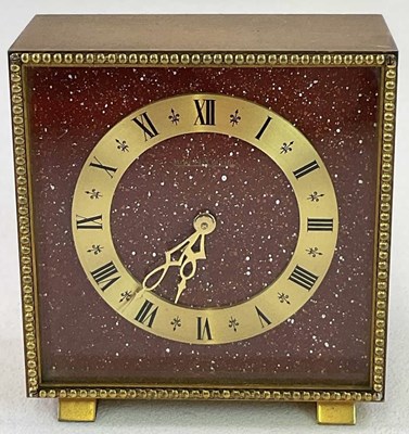 Lot 521 - JAEGER LECOULTRE; a brushed brass desk clock...
