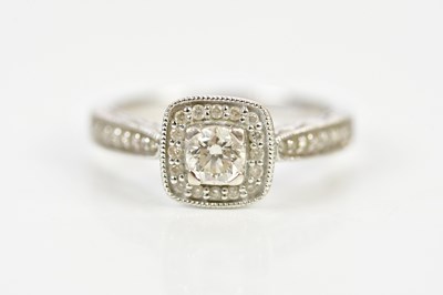 Lot 131 - An 18ct white gold diamond set ring with...