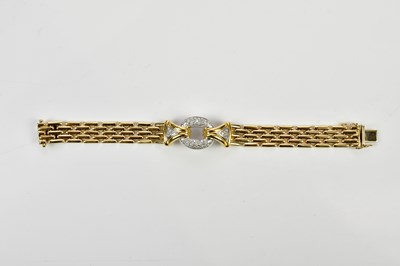 Lot 393 - An 18ct yellow gold bracelet with diamond set...