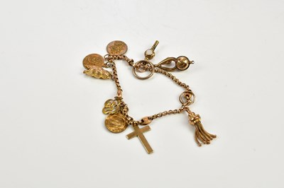 Lot 449 - A small 9ct gold charm bracelet set with...