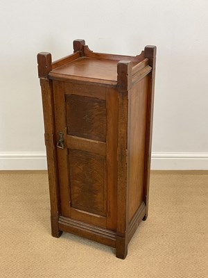 Lot 559 - A late 19th century oak bedside cabinet, with...
