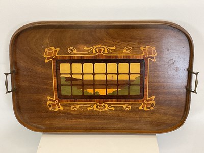 Lot 544 - An Art Nouveau wooden tray with inlay...