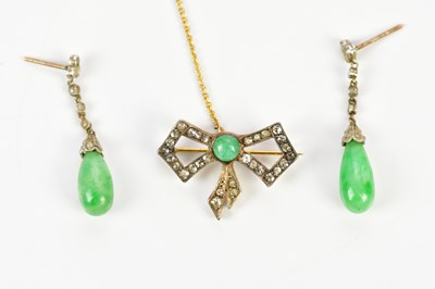 Lot 359 - A yellow and white metal diamond bow brooch...