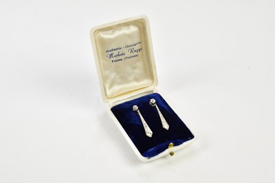 Lot 317 - A pair of white metal diamond drop earrings,...
