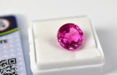 Lot 1075 - A loose 8.30 carat round ruby with GIL...