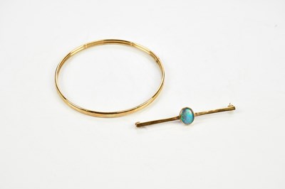 Lot 374 - A 9ct yellow gold bangle, approx 4.1g, and a...