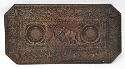 Lot 581 - An Indian carved table top with central image...