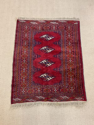 Lot 449 - A Persian rug with four central medallions,...