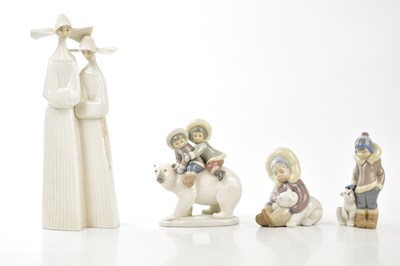 Lot 2823 - LLADRÓ; a collection of four figures including...