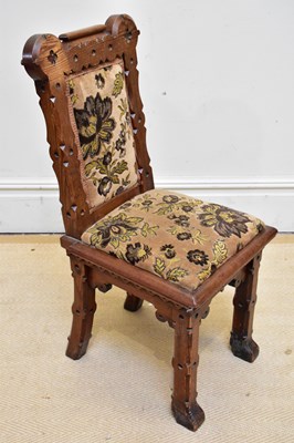 Lot 1131 - A Victorian pitch pine gothic style hall chair,...