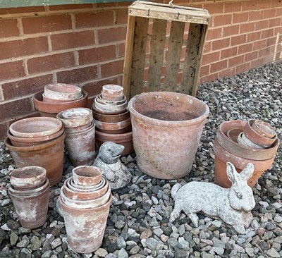 Lot 464 - A quantity of terracotta flower pots with two...