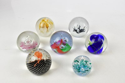 Lot 3032 - CAITHNESS; a collection of seven paperweights...