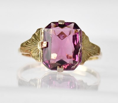Lot 1098 - A 9ct gold dress ring set with square cut...