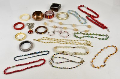 Lot 479 - A small collection of bangles, beads and...