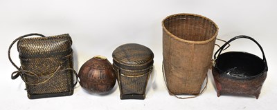Lot 584 - Three woven baskets, including two lidded...