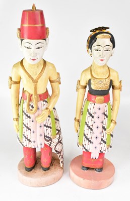 Lot 642 - A pair of Indonesian carved and painted wooden...