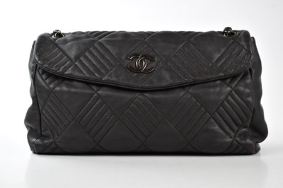 Lot 724 - CHANEL; a rare aubergine lambskin leather in...