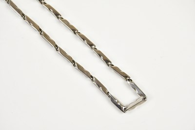 Lot 274 - A white metal necklace stamped 750 losar to...