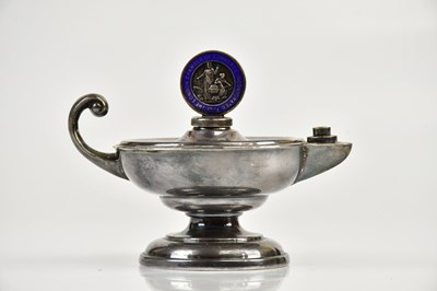 Lot 2155 - A white metal table lighter, the wick with...